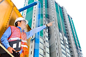Asian worker or supervisor on building site