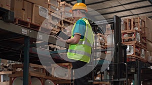 Asian Workers partners walking to inspect goods in retail Warehouse