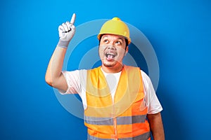 Asian workers wearing helmets are seen looking for ideas