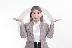 Asian working woman is smiling and shows her hands to present something.