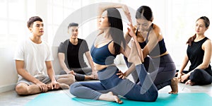 Asian Yoga coach tarining to yoga student Panorama