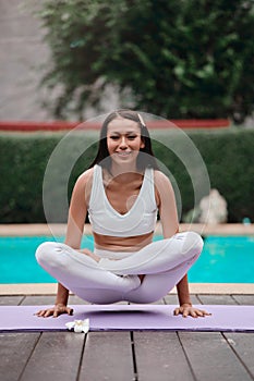 Asian Yoga instructor, in outdoor exercise