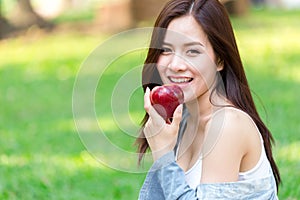 Asian young beautiful girl with red apple