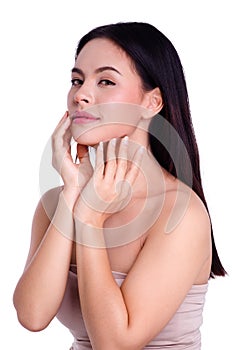 Asian young beautiful woman smiling and touching her face, isolated over white background. natural makeup, SPA therapy, skincare,