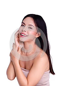 Asian young beautiful woman smiling and touching her face, isolated over white background. natural makeup, SPA therapy, skincare,