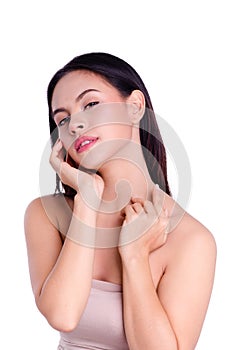 Asian young beautiful woman smiling and touching her face, isolated over white background. natural makeup, SPA therapy, skincare,