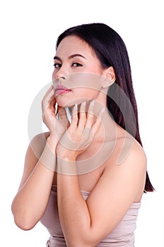 Asian young beautiful woman smiling and touching her face, isolated over white background. natural makeup, SPA therapy, skincare,