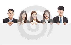 Asian young business people holding white board