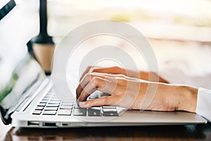 Asian young business woman lifestyle using laptop computer at cafe coffee shop