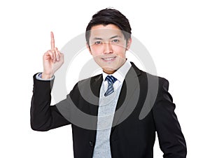 Asian young businessman with finger point up