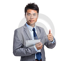 Asian young businessman hold with tablet pc and thumb up