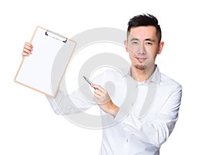 Asian Young Businessman pen point to clipboard