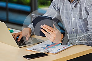 Handsome man using touchpad checking his mail