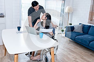 Asian young couple, Woman are patients sitting on a wheelchair