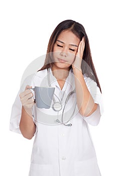 Asian young female doctor got sick with a cup of coffee