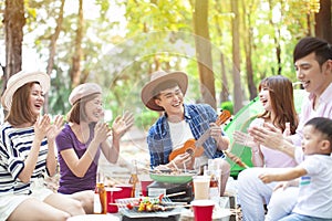 asian young group enjoying picnic party and camping