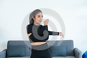 Asian young healthy woman in sportware practicing yoga at home, Sport girl exercise in living room at home