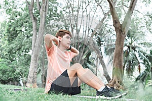 Asian young man attractive and handsome, exercising in the park