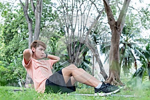 Asian young man attractive and handsome, exercising in the park, to keeping good healthy with exercise concept.