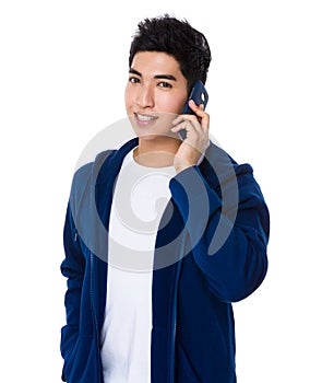 Asian Young Man chat on mobile phone