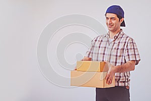 Asian young man holding box package, delivery man