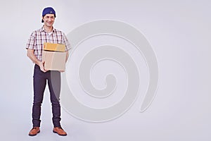 Asian young man holding box package, delivery man