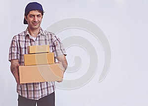 Asian young man holding box package, delivery man