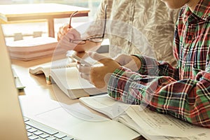 Asian young man,Homosexuality or woman sitting pointing studying examining.