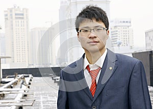 Asian young man in suit with tie