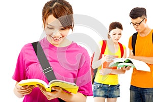 Asian young student read a book with classmates