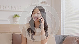 Asian young woman answer the phone and talking with positive and happiness emotional.Attractive female talkin in smartphone smile