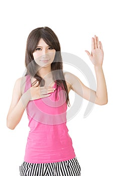 Asian young woman give a gesture of swear