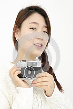 Asian young woman with old film camera