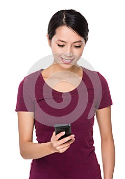 Asian young woman read the text mesaage on cellphone