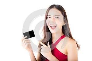 Asian young woman with red dress holding a credit card and smiling.