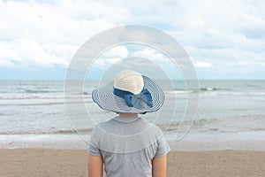 Asian young woman standing facing the sea. Feeling really lonely, heartbroken sea like a nursery of clearing the mind. The concept