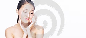 Beauty, cosmetics, healthy, treatment, skincare and spa concept. Asian young woman touching own face with clear fresh skin.