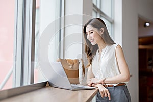 Asian young woman use laptop