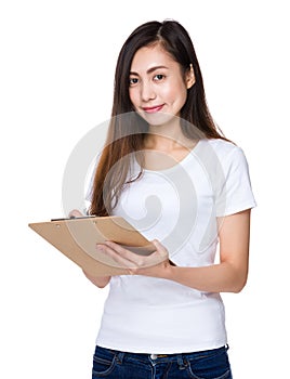 Asian young woman write on file board