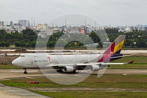 Asiana Cargo Boeing 747-446F Taxiing On Runway Of Tan Son Nhat International Airport, Vietnam.