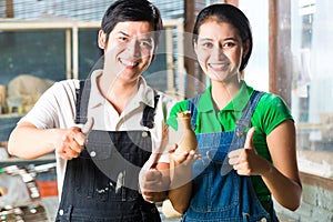 Asians with handmade pottery