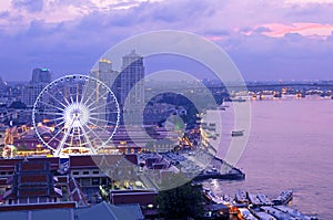 Asiatique against Chao Phraya river at twilight photo