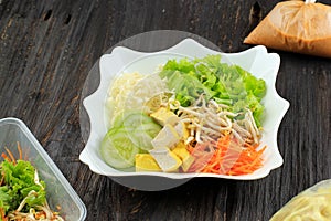 Asinan Betawi. Indonesian Raw Vegetable and Yellow Tofu Bean Curd with  Tangy Peanut Dressing  from Betawi, Jakarta. Topped with