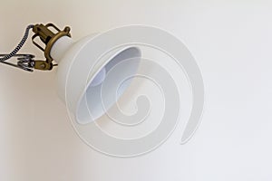 Asjusted white lamp on the wall background