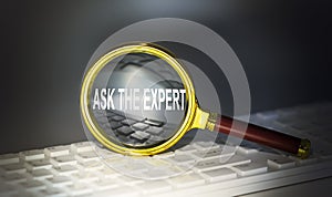 ASK THE EXPERT word concept on a magnifier on the keyboard
