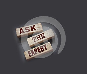 Ask the Expert words on wooden blocks. Consulting a professional, master or consultant for a solution and advice