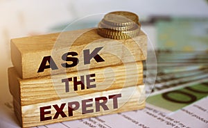 Ask the Expert words on wooden blocks. Consulting a professional, master or consultant for a solution and advice business concept