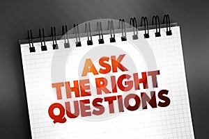 Ask The Right Questions text on notepad, concept background