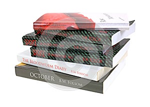 Askew stack of soft cover books