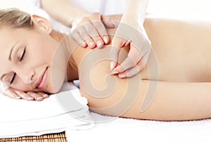 Asleep woman receiving an acupuncture treatment